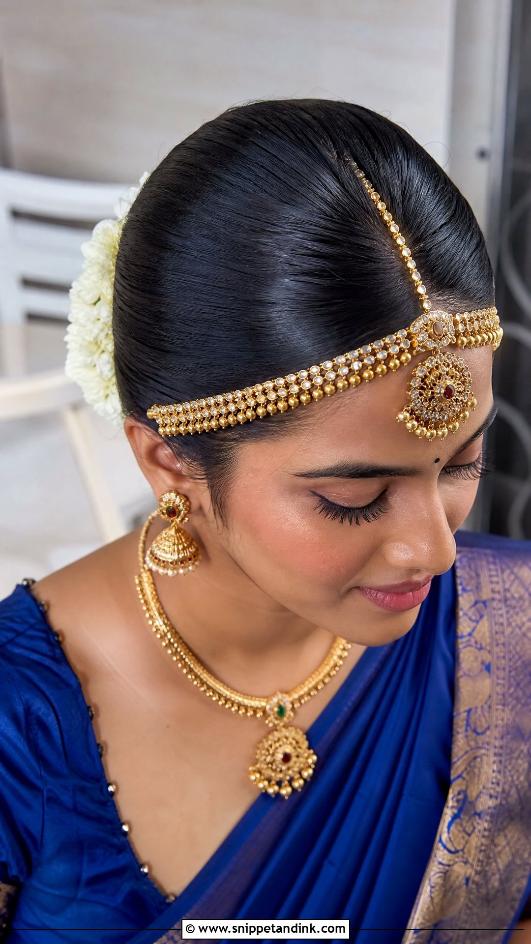 Sleek Bun With Maang Tikka - Snippet and Ink - 20 Tamil Wedding Hairstyle Ideas