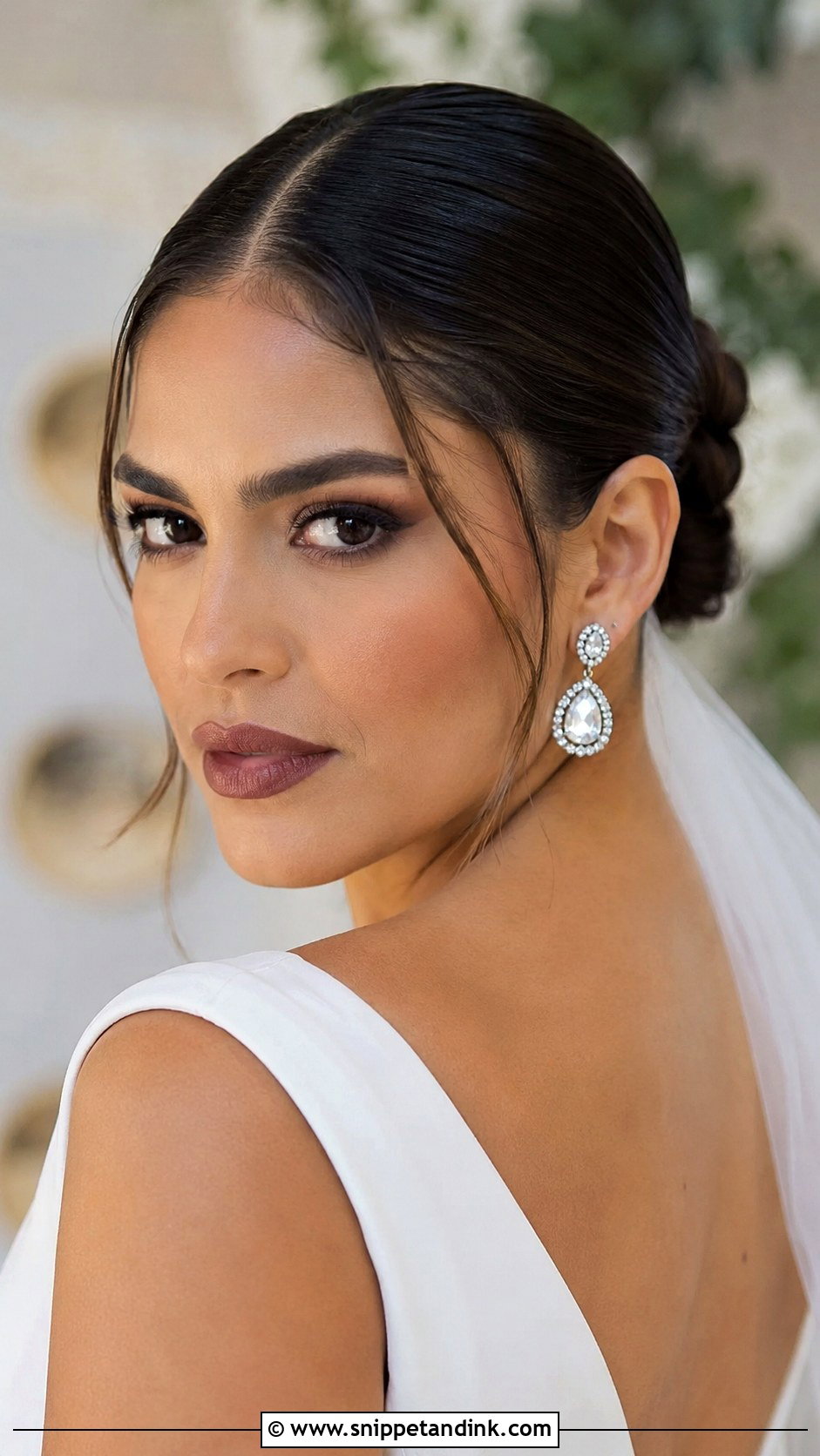 Sleek Bun With Middle Part Baby Hairs - Snippet and Ink - 20 Sleek Wedding Hairstyles