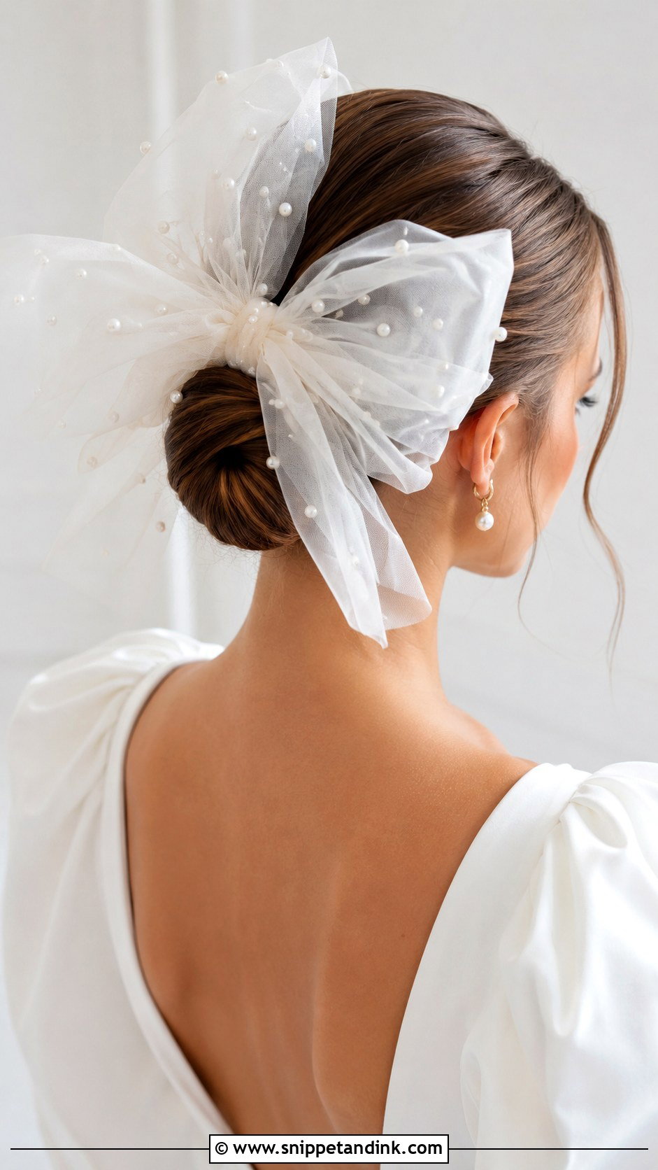 Sleek Bun With Oversized Tulle Bow - Snippet and Ink - 20 Wedding Hairstyles with Bow