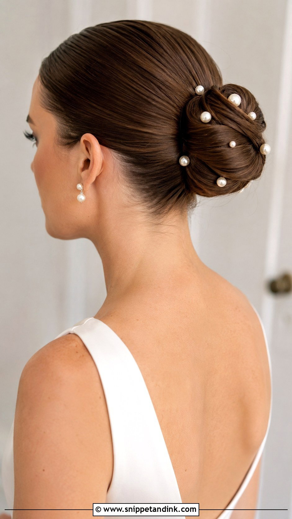 Sleek Bun With Pearl Hair Accessories - Snippet and Ink - 20 Slicked Back Bun Wedding Hair Ideas