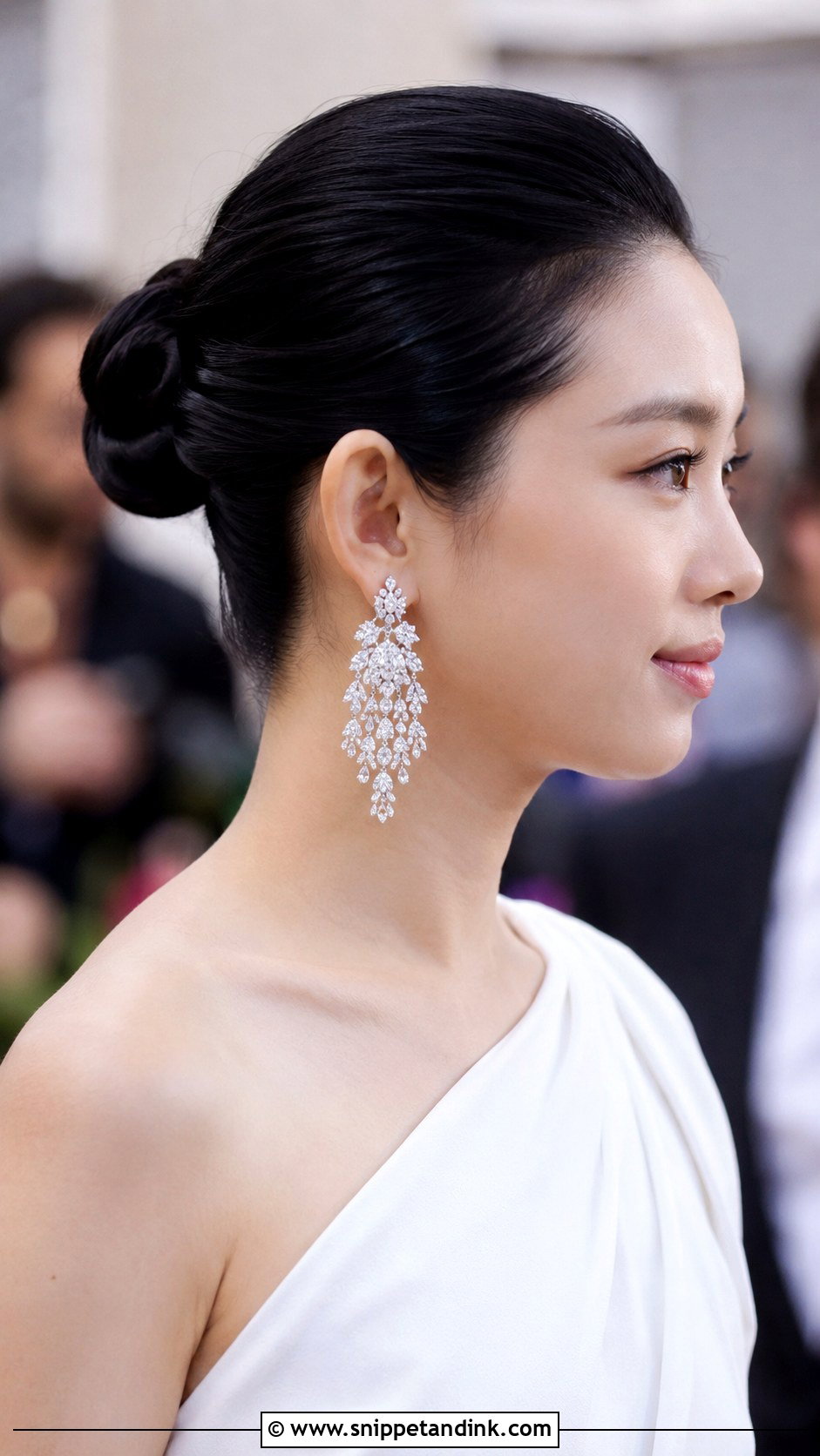 Sleek Bun With Statement Earrings - Snippet and Ink - 35 Bridal Bun Ideas