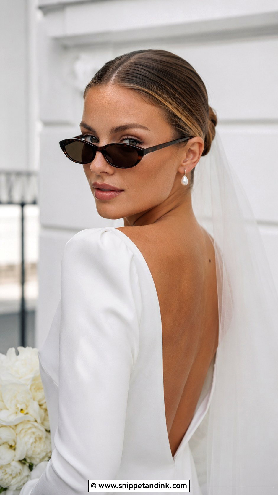 Sleek Bun With Tinted Sunglasses - Snippet and Ink - 20 Sophia Richie Wedding Hair Ideas