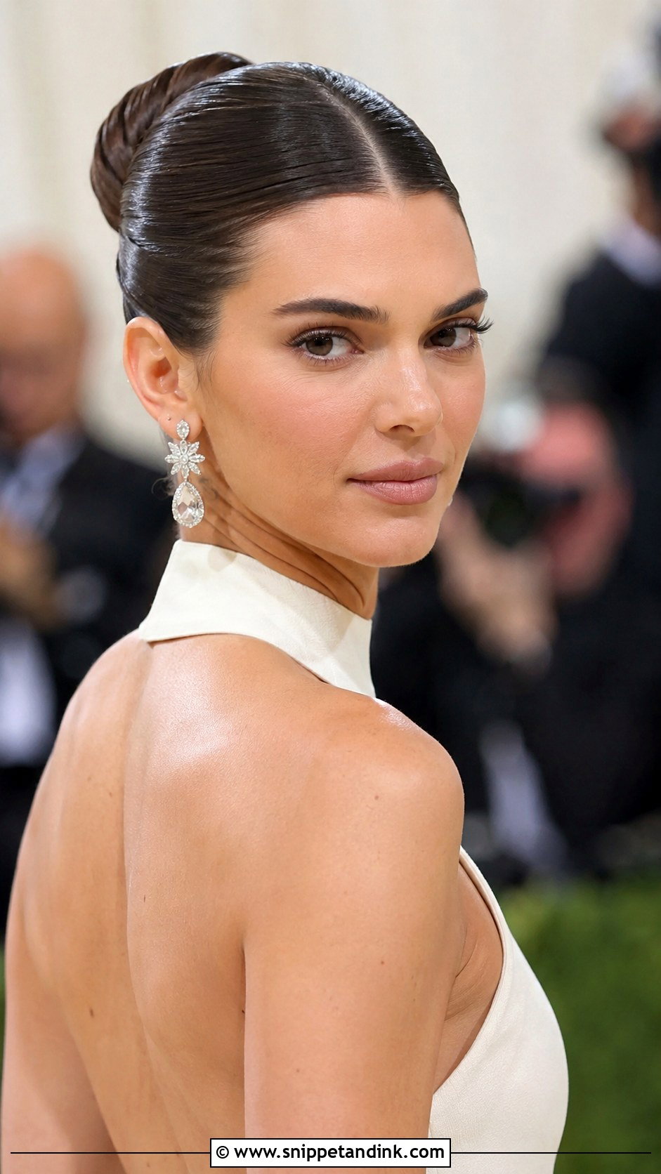 Sleek Bun with Center Part - Snippet and Ink - 30 Hair Styles for Long Hair for Weddings