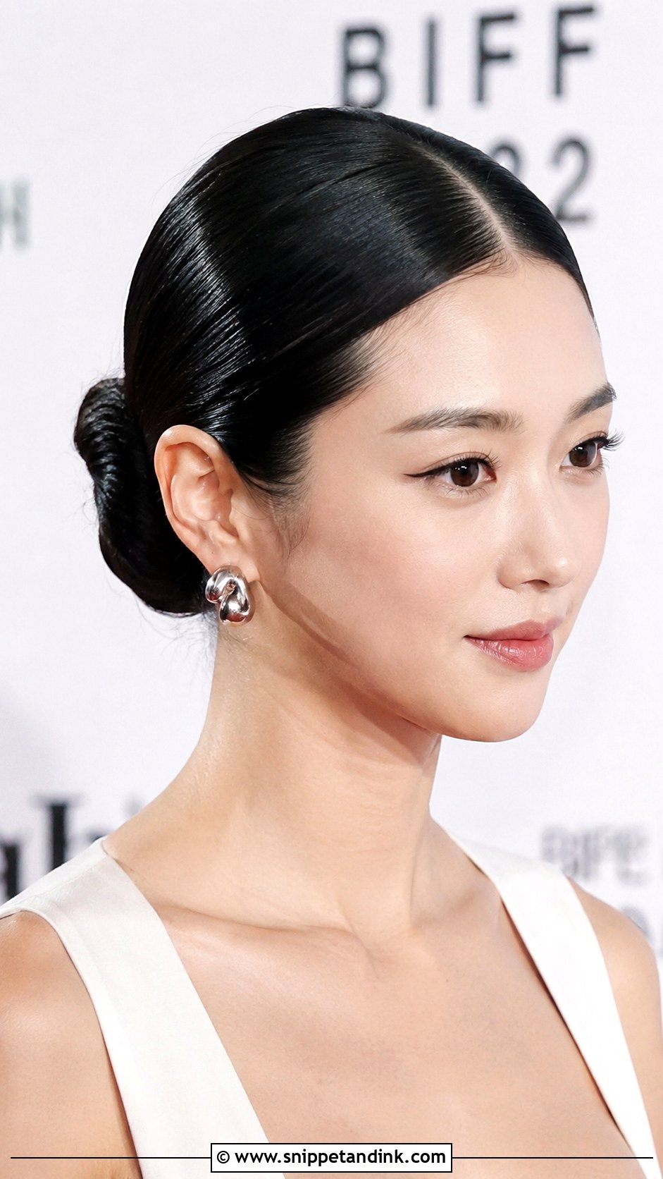 Sleek Center Part Bun - Snippet and Ink - 20 Black Tie Wedding Guest Hair Ideas