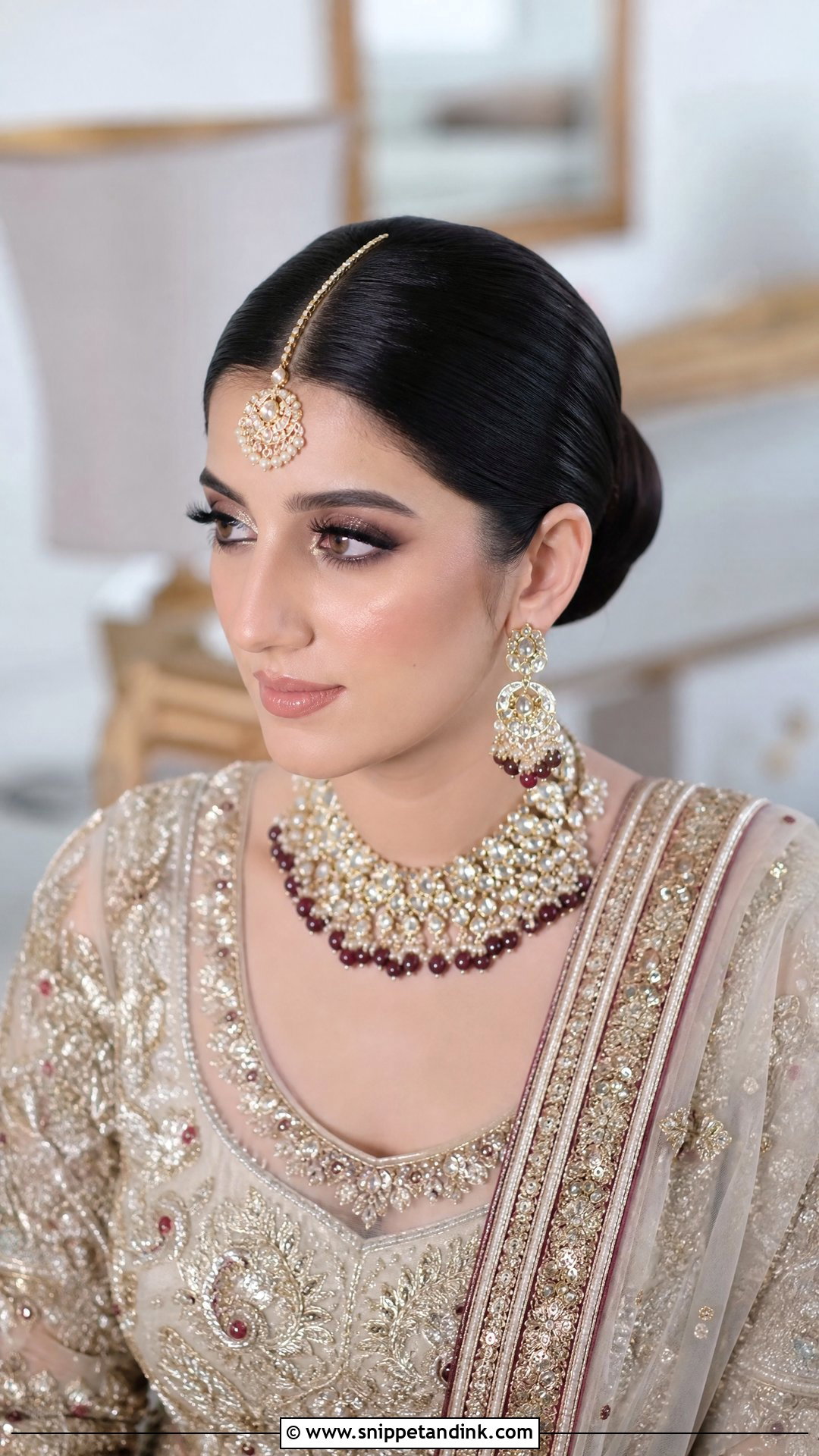 Sleek Center Parted Bun - Snippet and Ink - 20 Pakistani Bridal Hairstyles Nikah