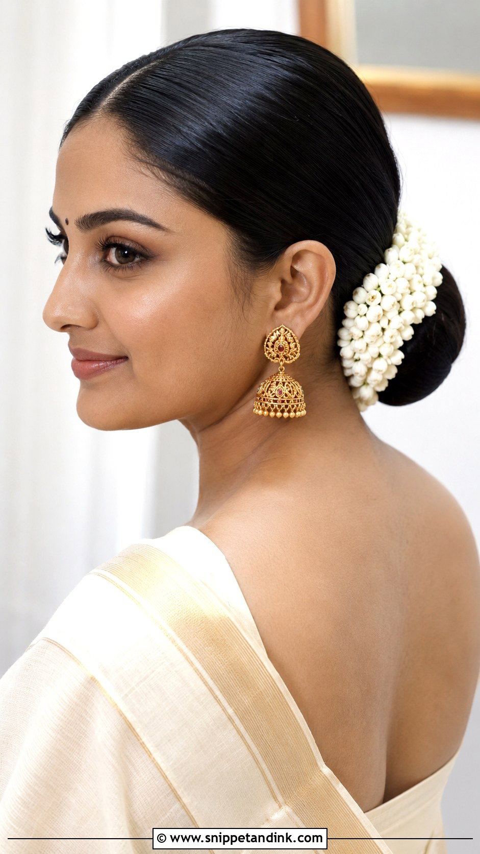Sleek Center Parted Bun - Snippet and Ink - 25 Kerala Wedding Hairstyle Ideas