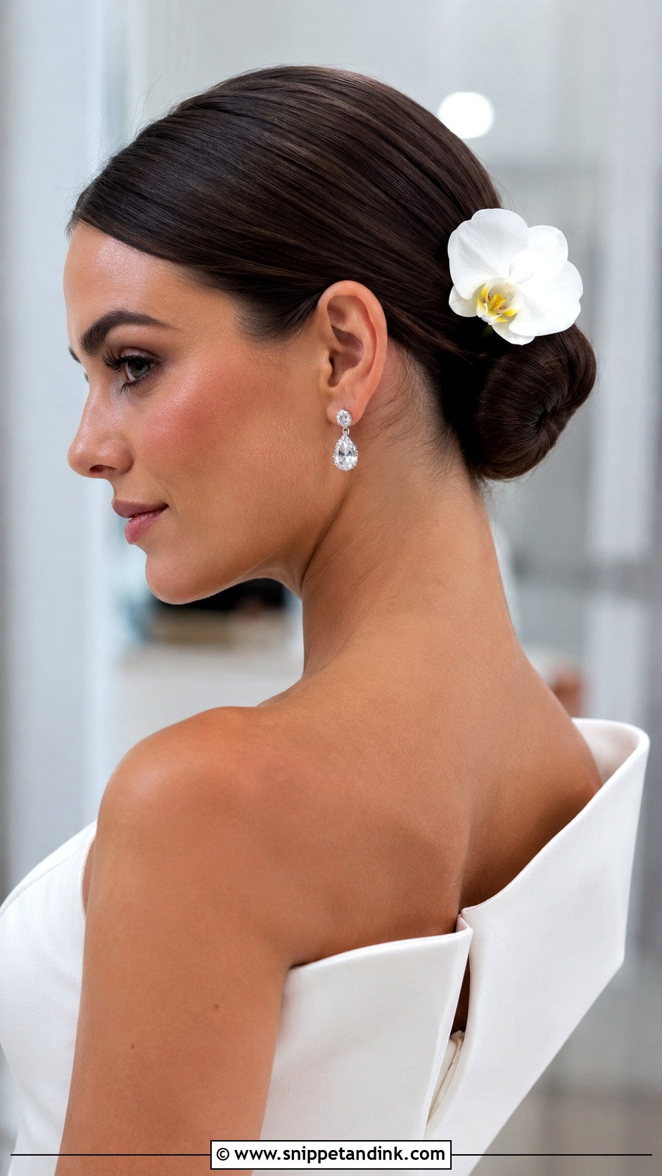 Sleek Chignon With Single Bloom - Snippet and Ink - 20 Bride Hair Flowers