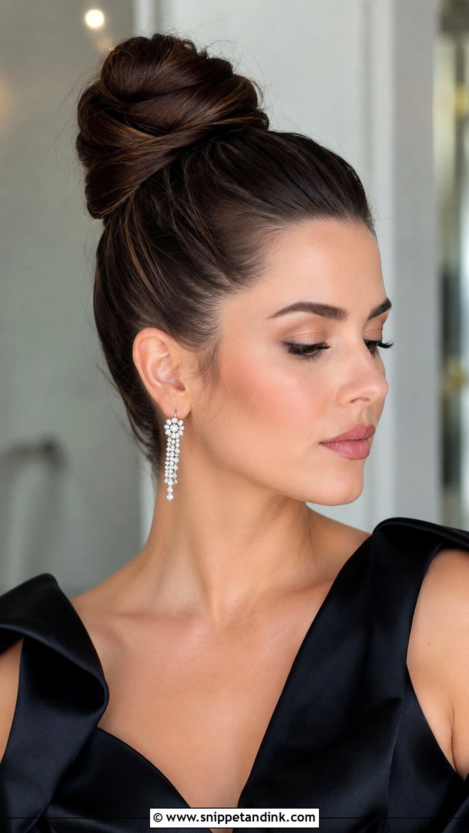 Sleek High Bun - Snippet and Ink - 25 Wedding Guest Hair Updo Ideas
