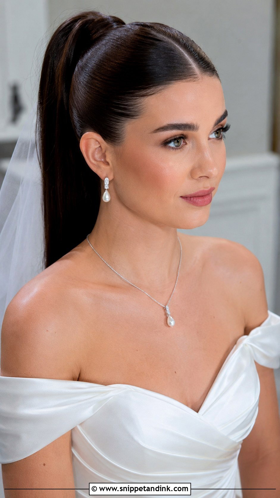 Sleek High Ponytail With a Middle Part - Snippet and Ink - 25 High Ponytail Wedding Hair Ideas