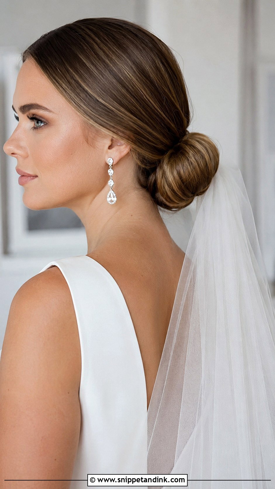 Sleek Low Bun - Snippet and Ink - 20 Winter Wedding Hair Ideas