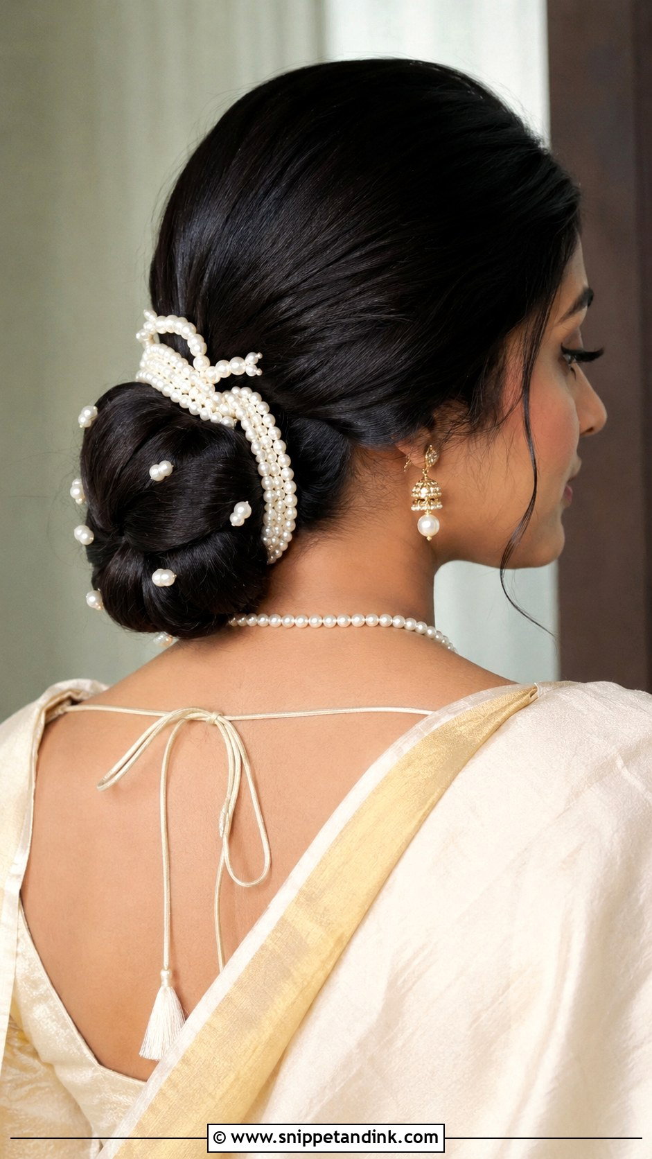 Sleek Low Bun With Brooch - Snippet and Ink - 25 South Indian Bride Engagement Hairstyle Ideas