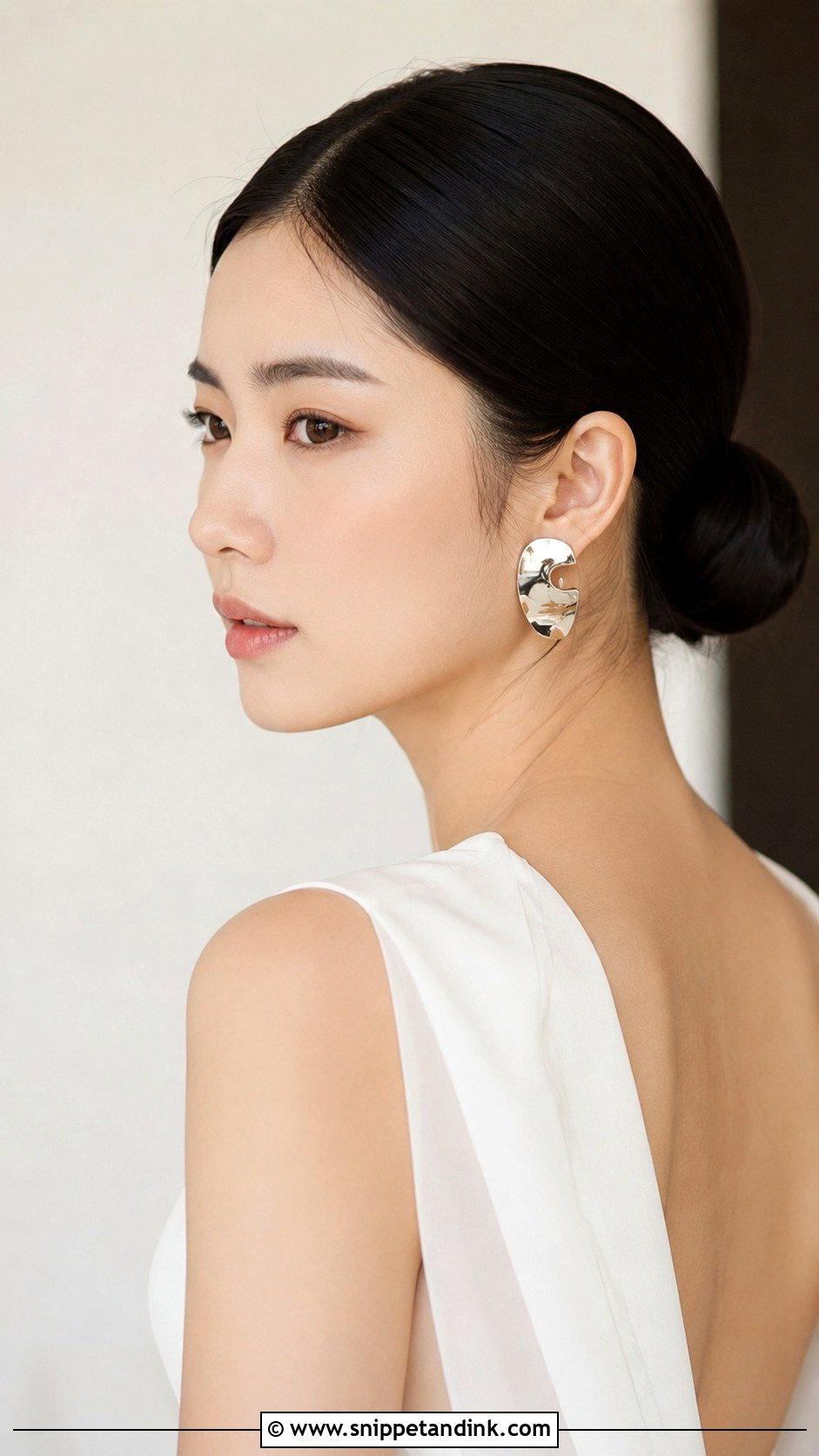 Sleek Low Bun With Center Part - Snippet and Ink - 20 Fall Wedding Hair Ideas