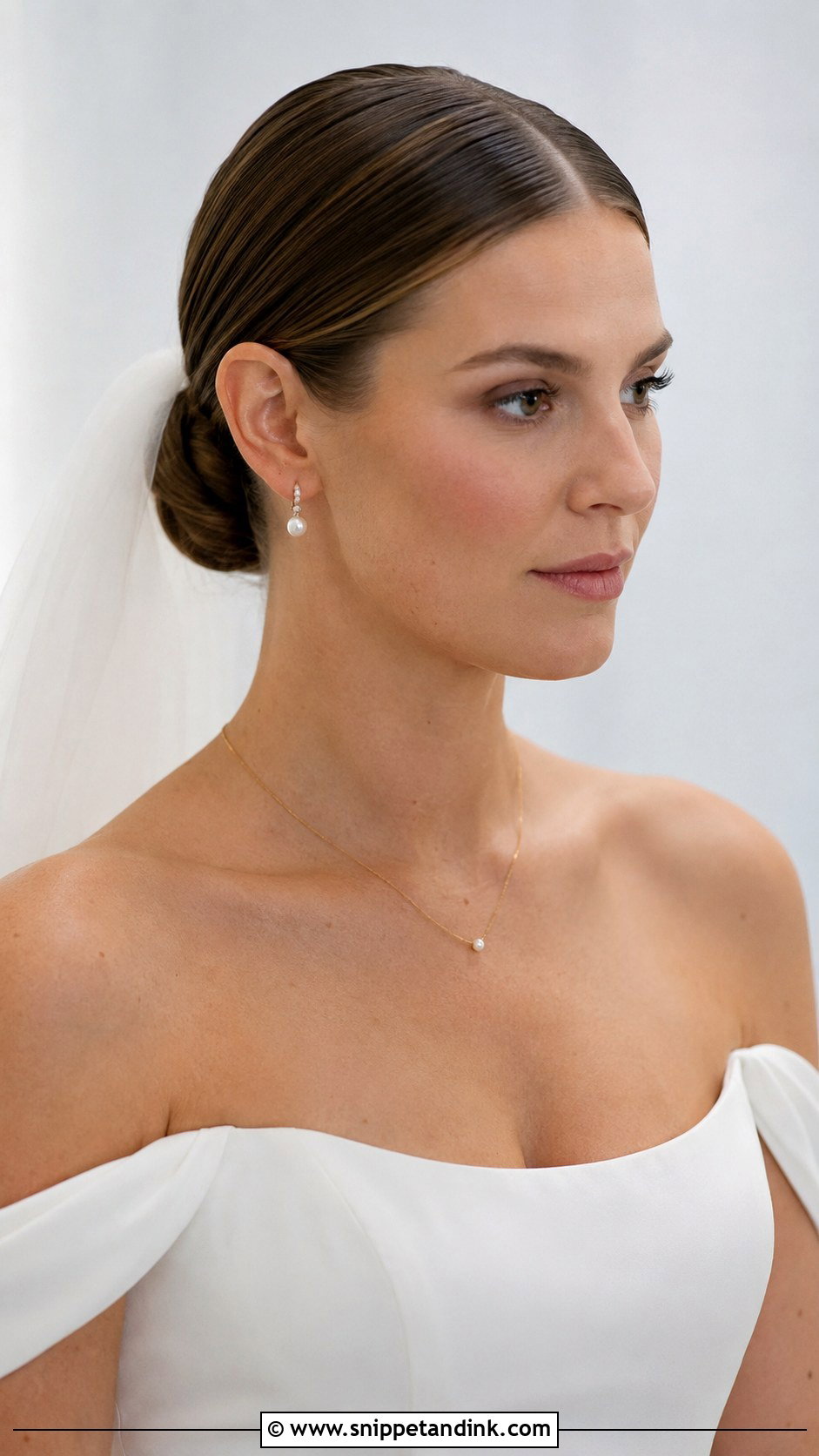 Sleek Low Bun With Center Part - Snippet and Ink - 20 Slick Back Wedding Hairstyles