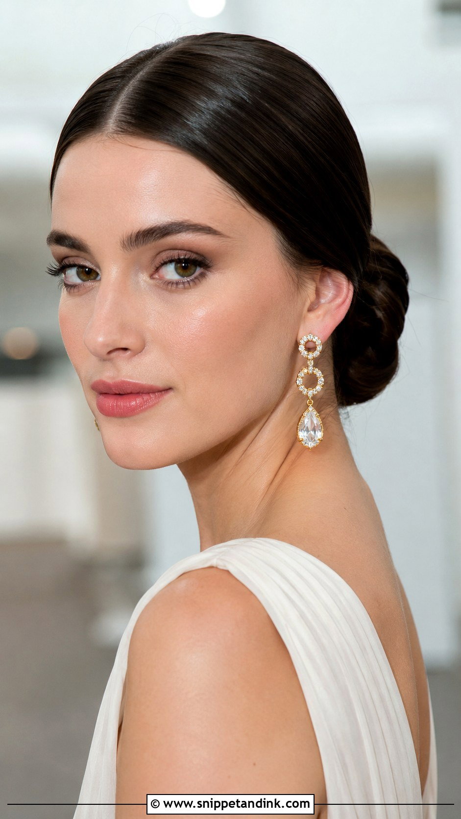 Sleek Low Bun With Center Part - Snippet and Ink - 25 Wedding Hair Up Do Ideas