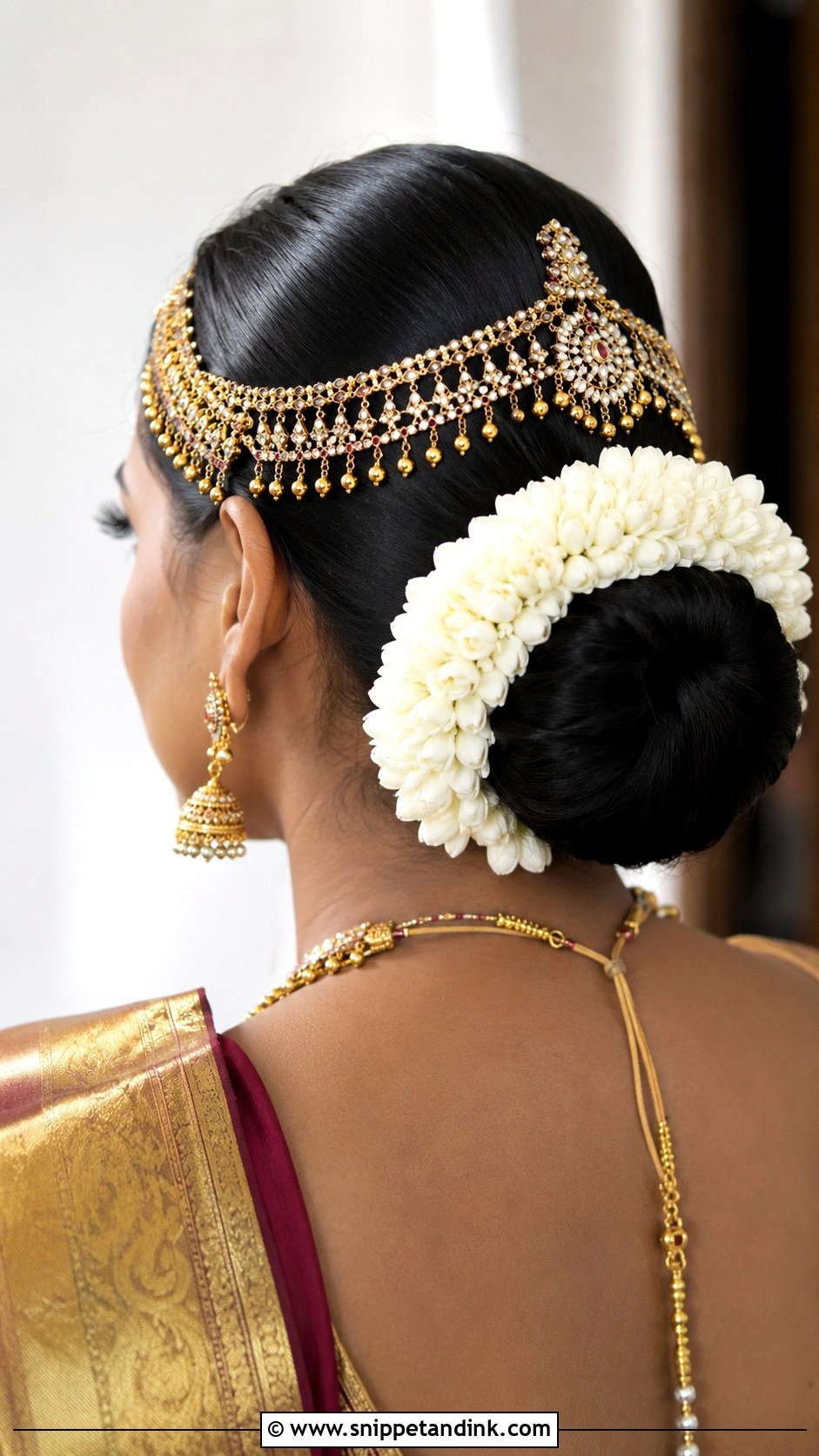 Sleek Low Bun With Matha Patti - Snippet and Ink - 20 Indian Hairstyles for Marriage Function