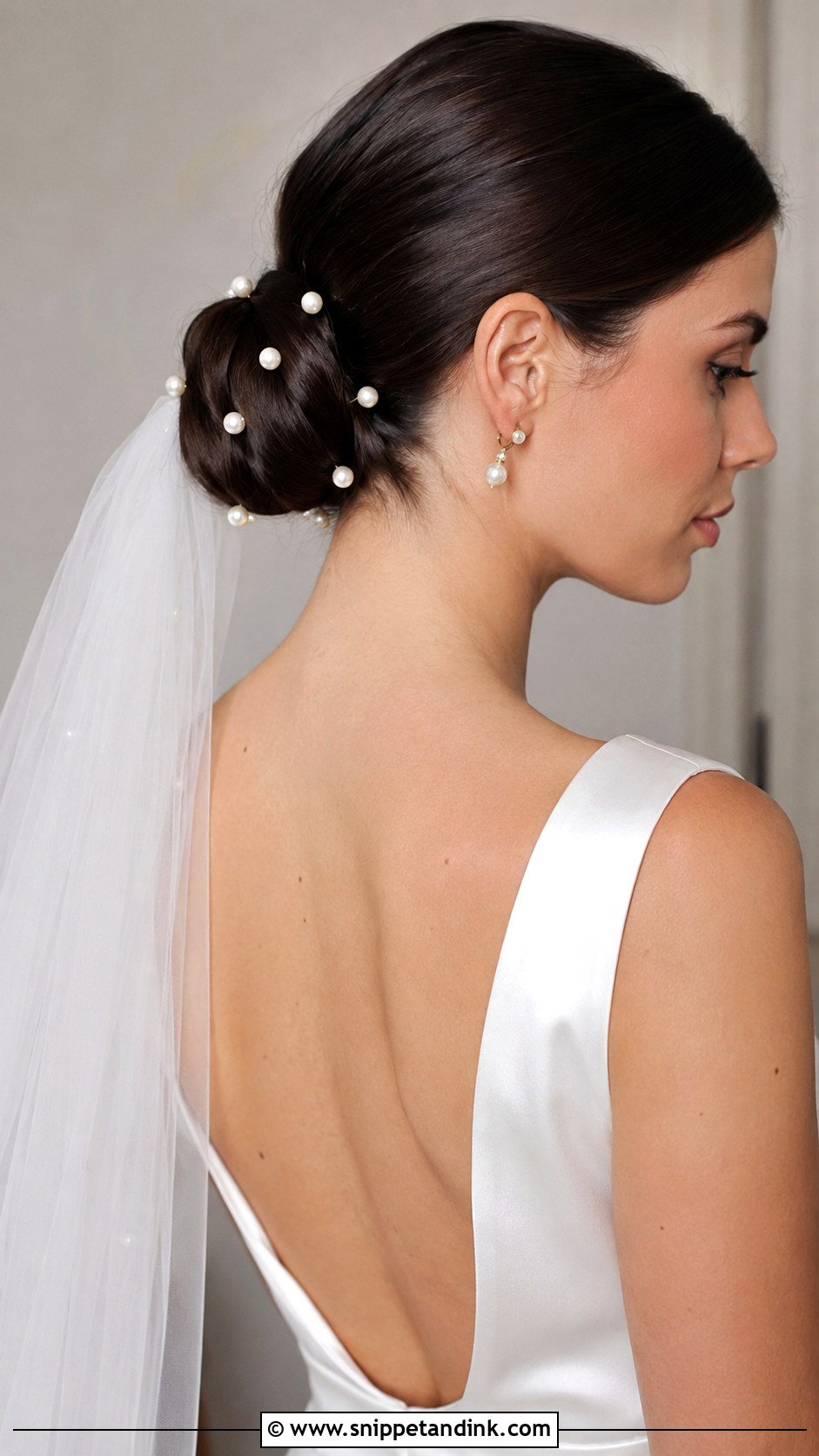 Sleek Low Bun With Pearl Pins - Snippet and Ink - 25 Wedding Hair Brunette Ideas
