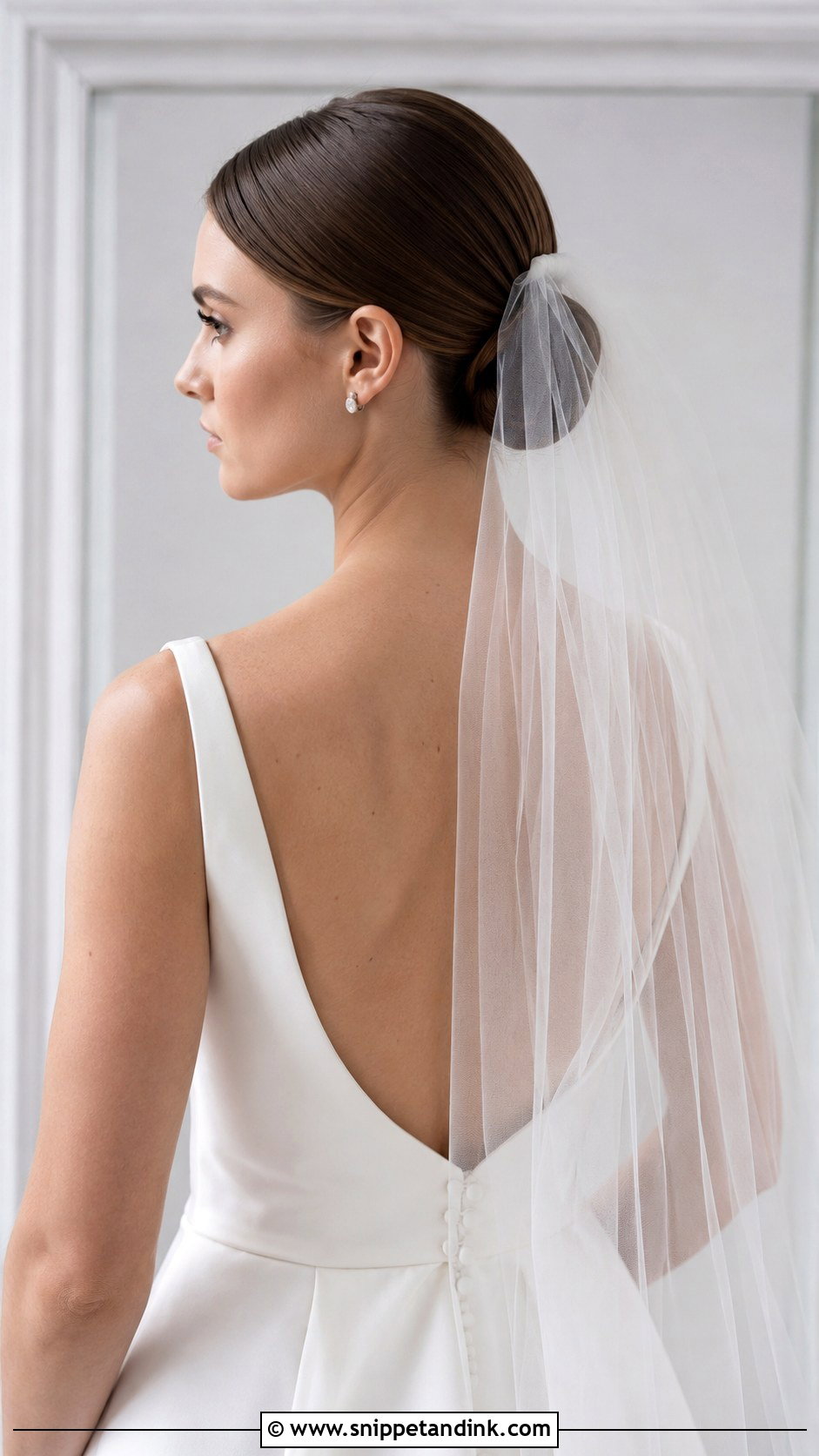 Sleek Low Bun With Veil - Snippet and Ink - 15 Sleek Low Bun Bridal Hair Ideas