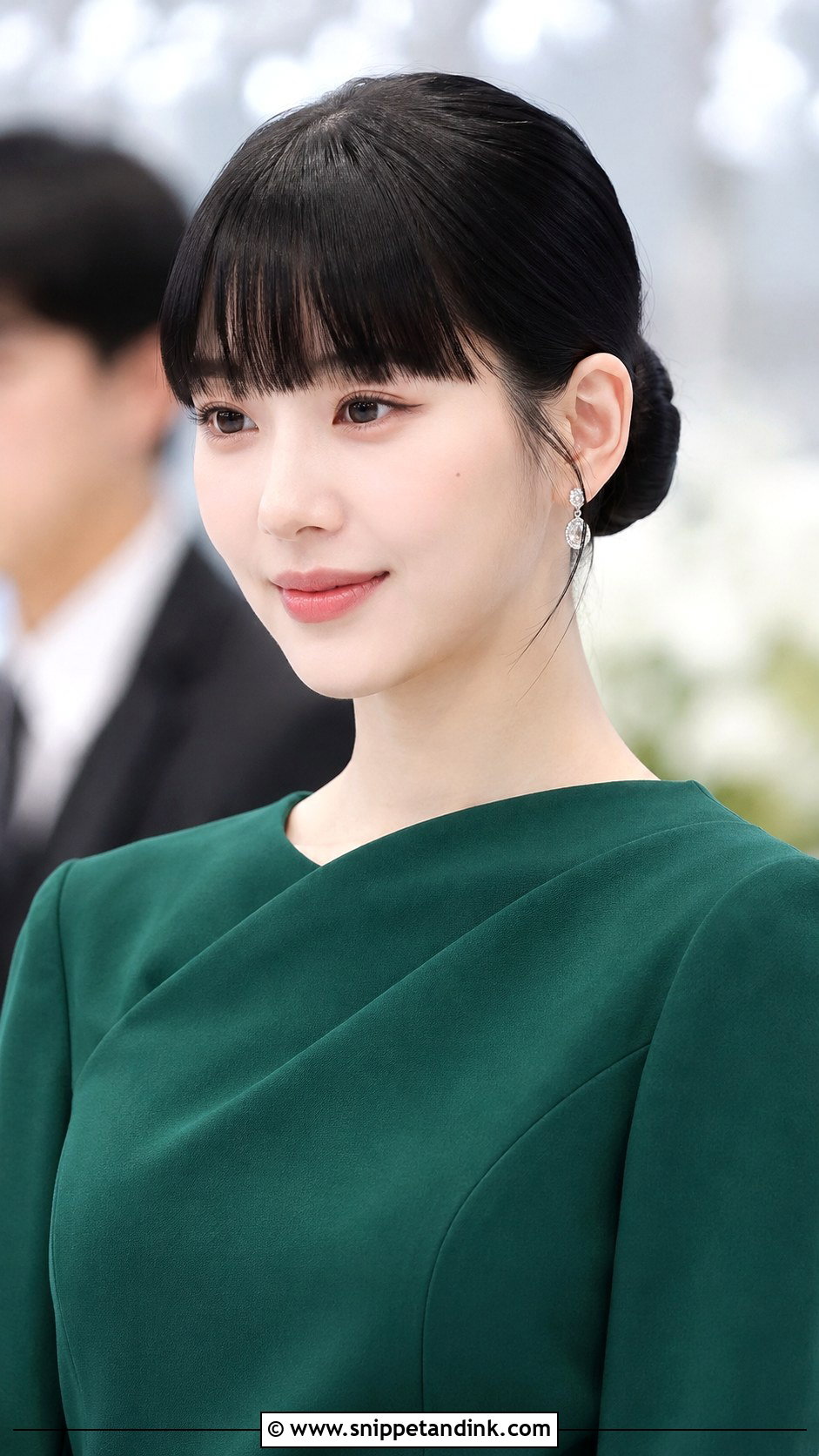 Sleek Low Bun with Blunt Bangs - Snippet and Ink - 25 Wedding Guest Hairstyles with Bangs