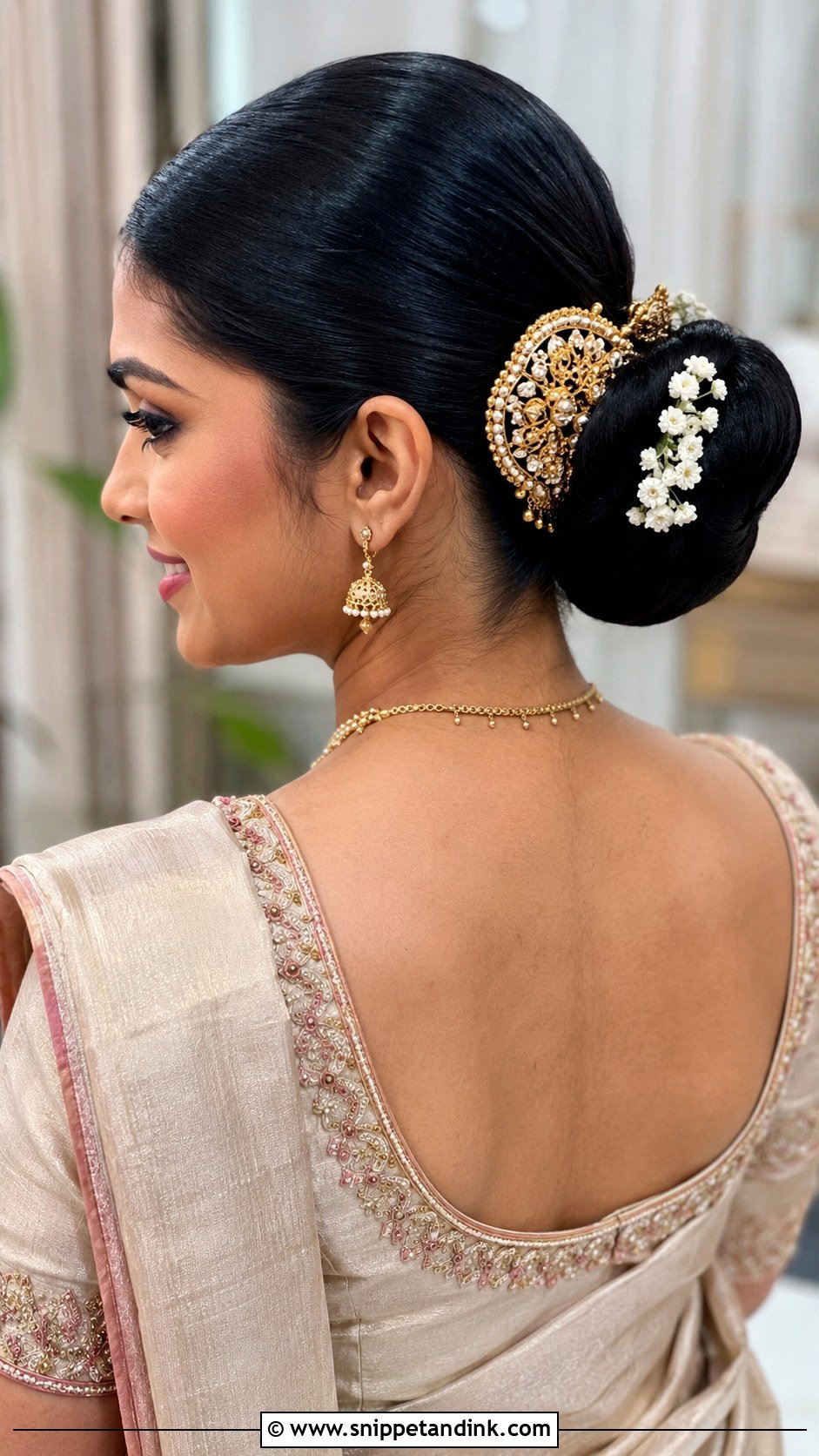 Sleek Low Bun with Hair Brooch - Snippet and Ink - 25 Kerala Hindu Bridal Hairstyles