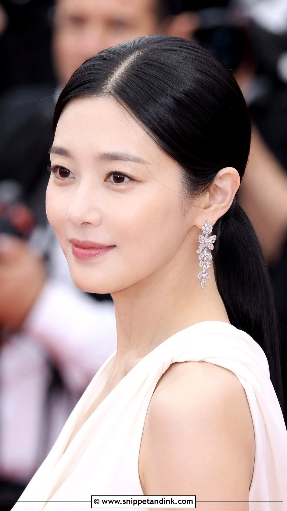 Sleek Low Ponytail With Center Part - Snippet and Ink - 30 Korean Wedding Hair Ideas