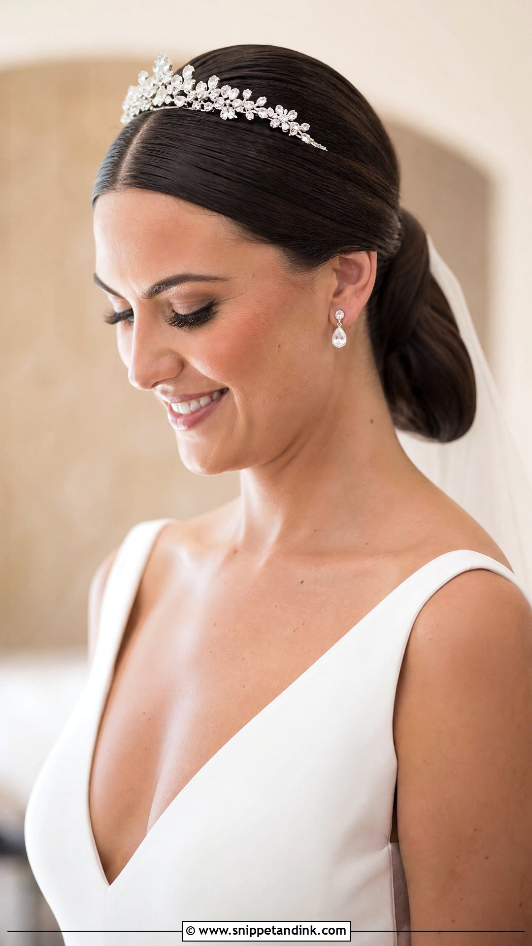 Sleek Low Ponytail With Crown - Snippet and Ink - 20 Bridal Hairstyle with Crown Ideas