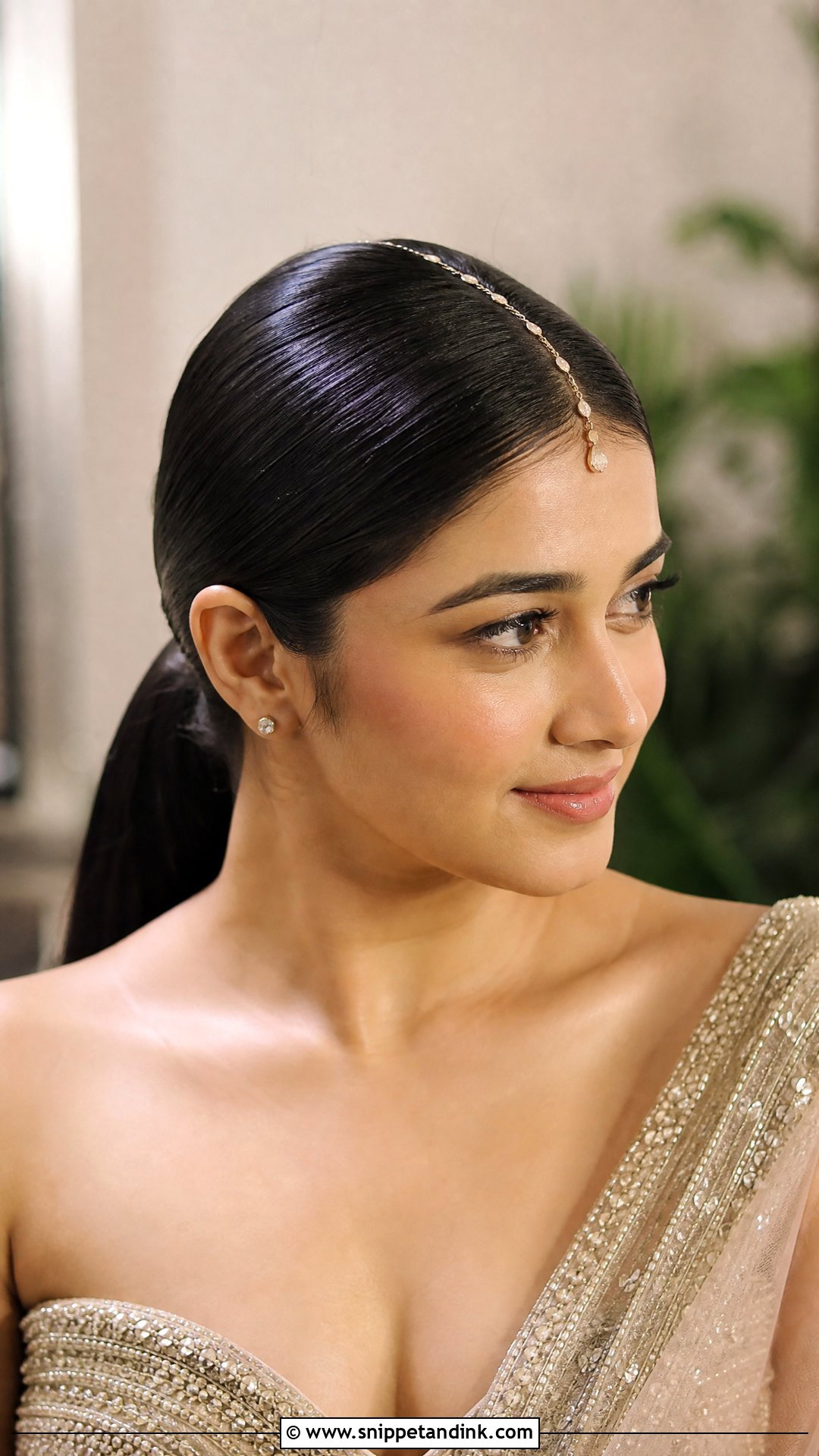 Sleek Low Ponytail With Hair Chain - Snippet and Ink - 20 Traditional Indian Wedding Hairstyles
