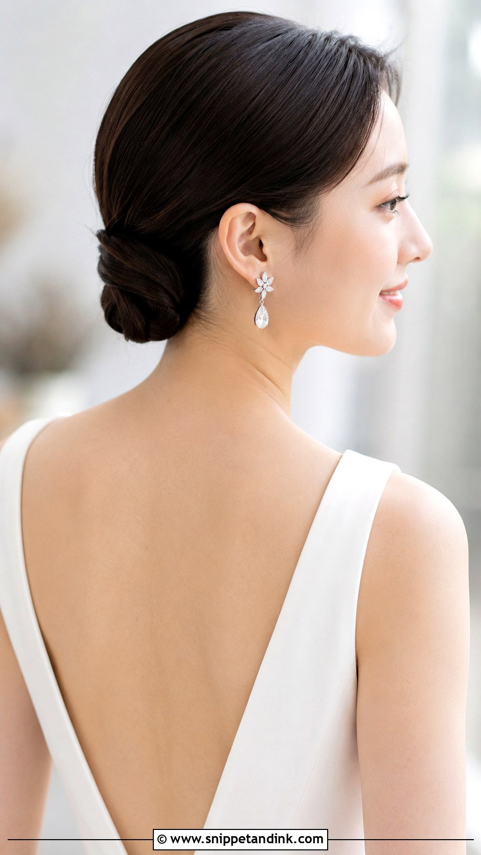 Sleek Low Twisted Bun - Snippet and Ink - 35 Bridal Updo Ideas