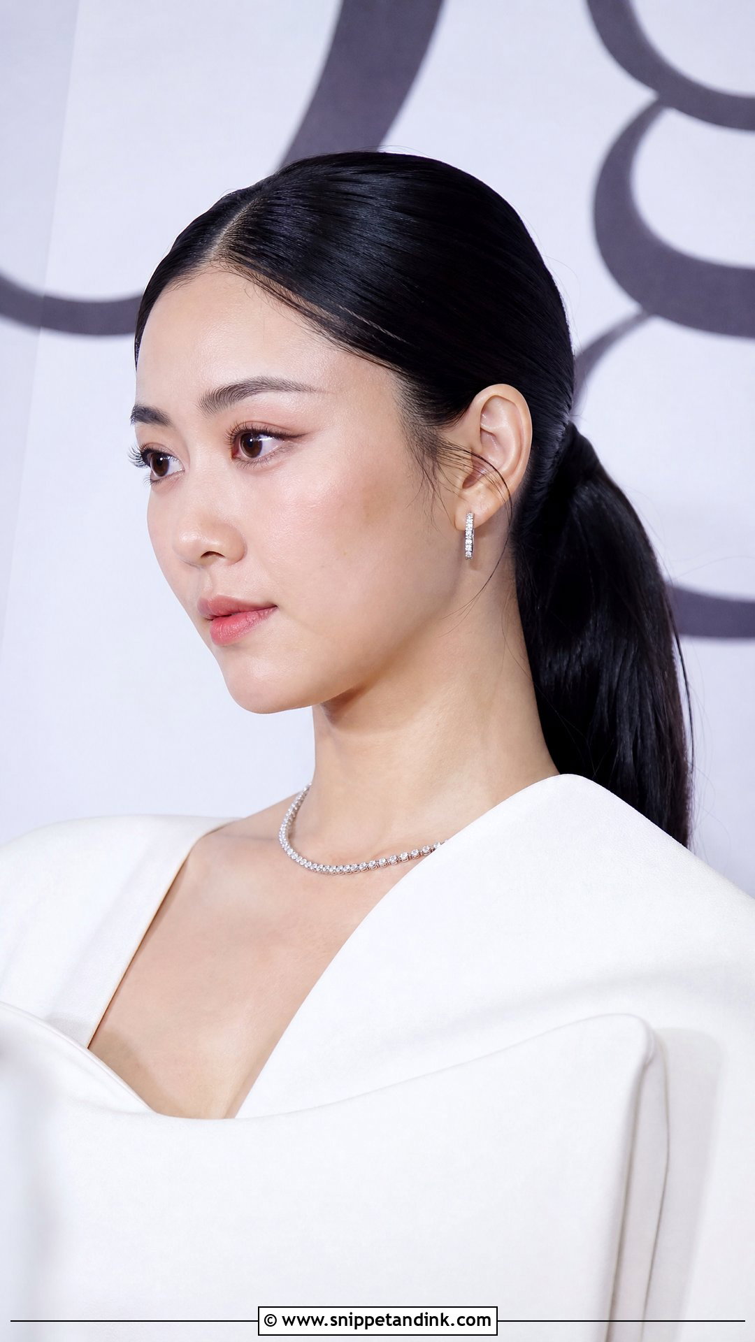 Sleek Ponytail With Middle Part - Snippet and Ink - 20 Party Pony Wedding Hairstyle Ideas