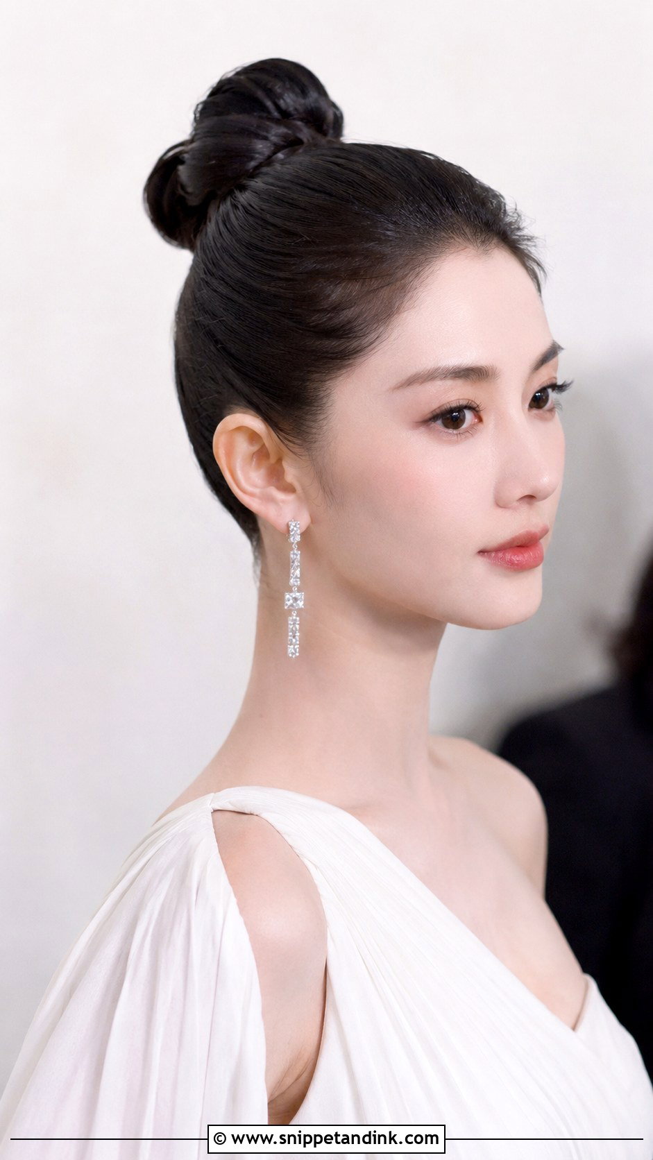 Sleek Top Knot - Snippet and Ink - 20 Black Tie Wedding Guest Hairstyles