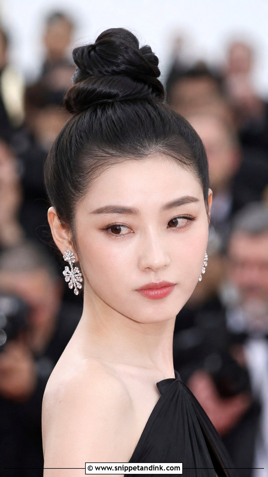 Sleek Top Knot - Snippet and Ink - 25 Wedding Hairstyles for Guests