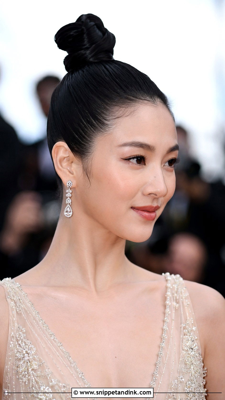 Sleek Top Knot - Snippet and Ink - 30 Wedding Guest Hairstyles