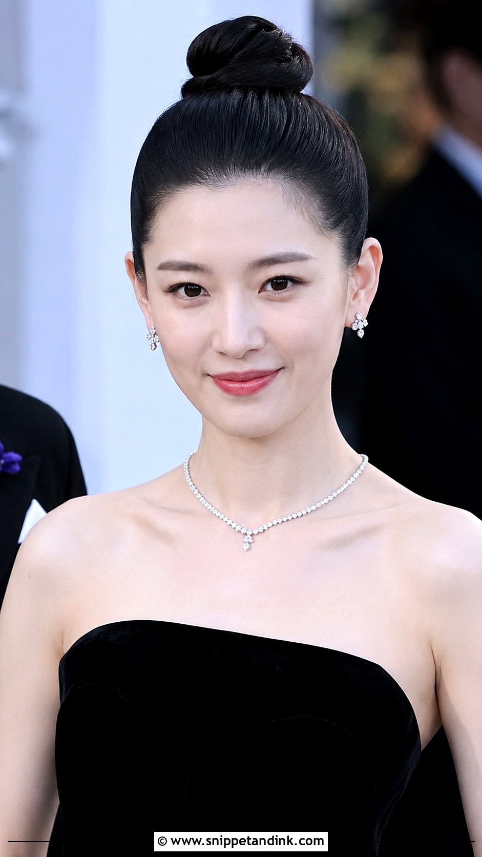 Sleek Top Knot - Snippet and Ink - 20 Long Black Tie Hairstyles