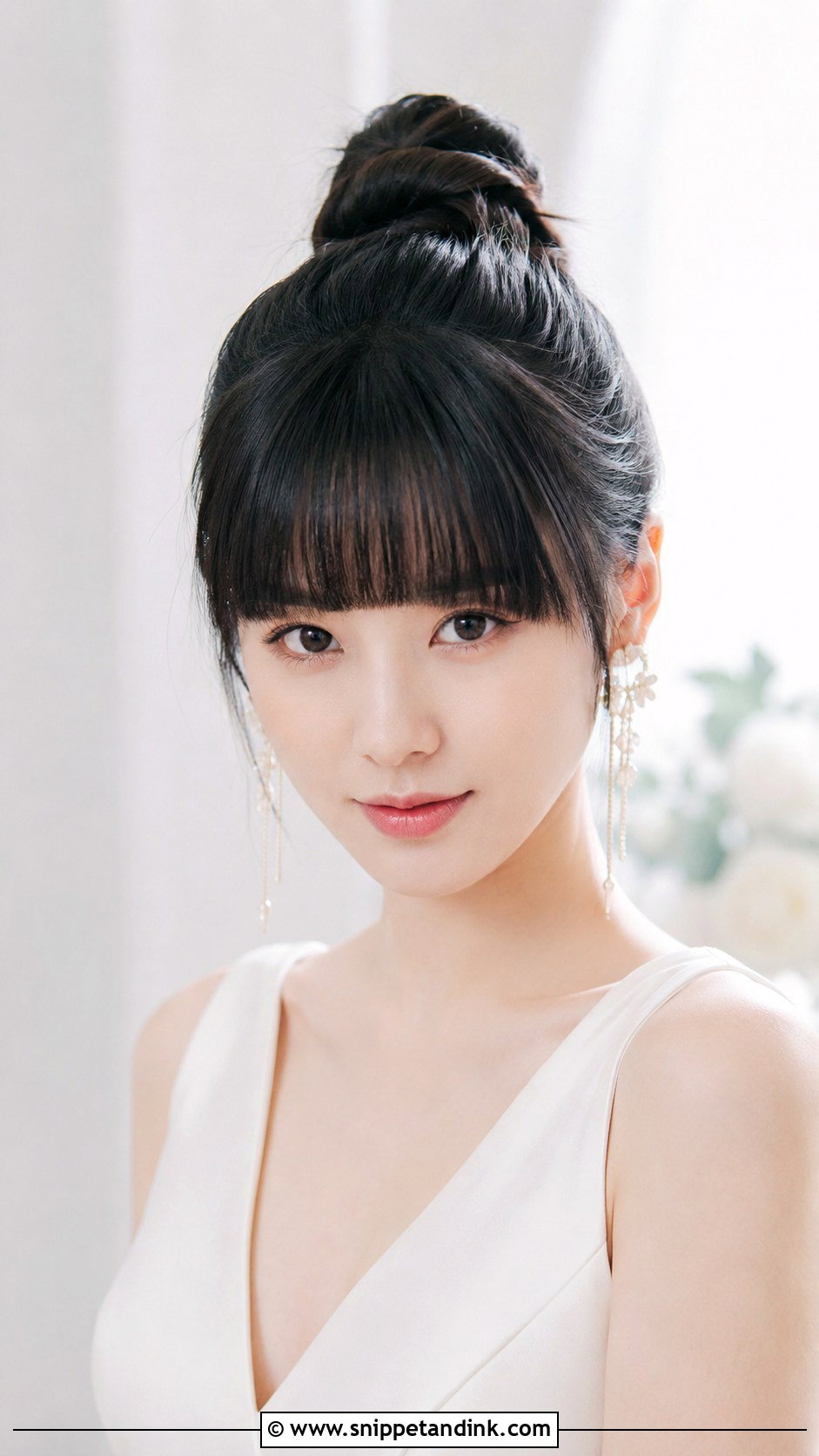 Sleek Top Knot With Blunt Bangs - Snippet and Ink - 25 Wedding Hairstyles with Bangs
