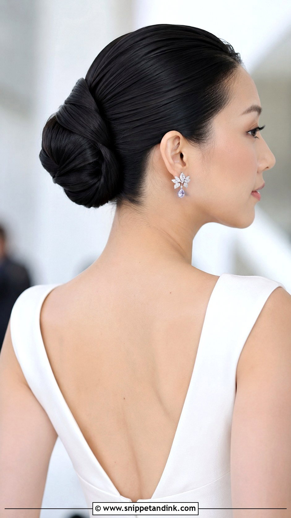 Sleek Twisted Bun - Snippet and Ink - 25 Bridal Updos for Long Hair