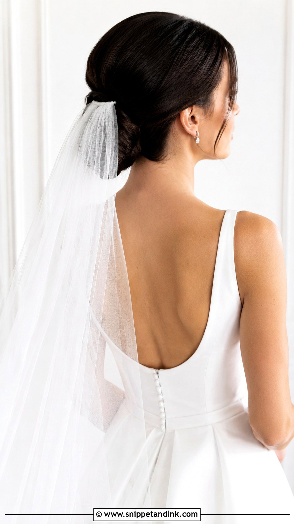 Sleek Wrapped Bun with Veil - Snippet and Ink - 25 Glam Bridal Hair Updo Ideas