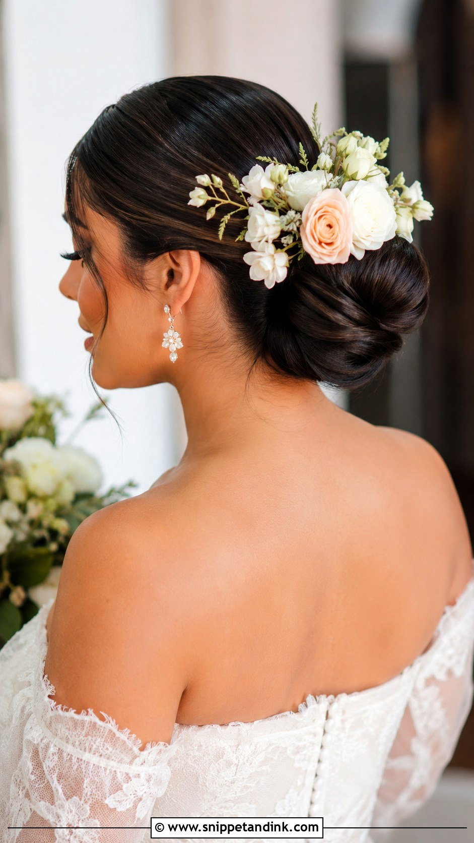 Slick Bun With Flowers Wedding Hairstyle - Snippet and Ink - 25 Slick Bun Wedding Hairstyles