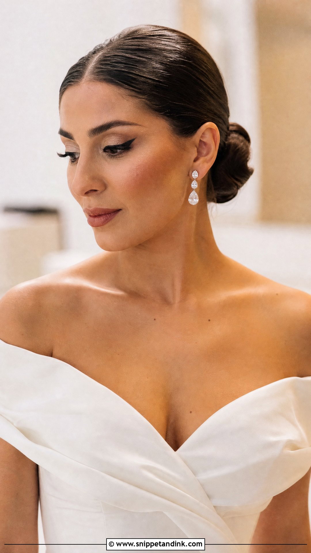 Slick Bun With Off Shoulder Gown - Snippet and Ink - 20 Slick Bun Wedding Ideas