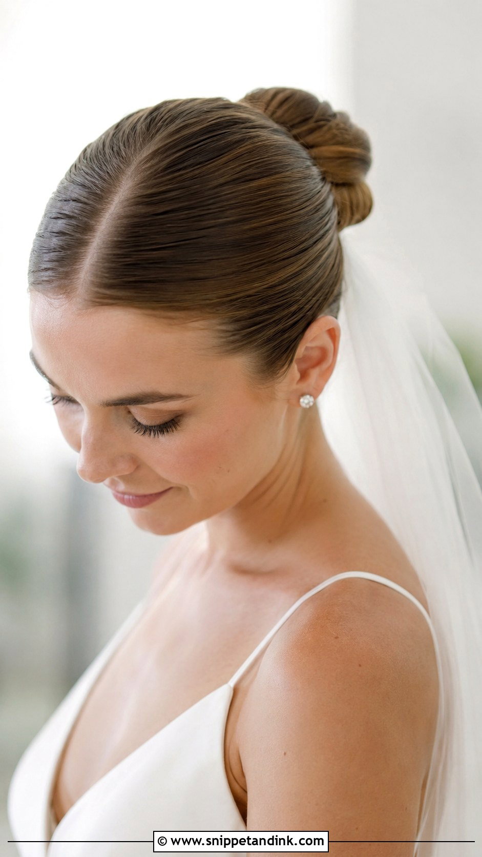 Slicked Back Bun With Middle Part - Snippet and Ink - 25 Slick Back Wedding Hair Ideas