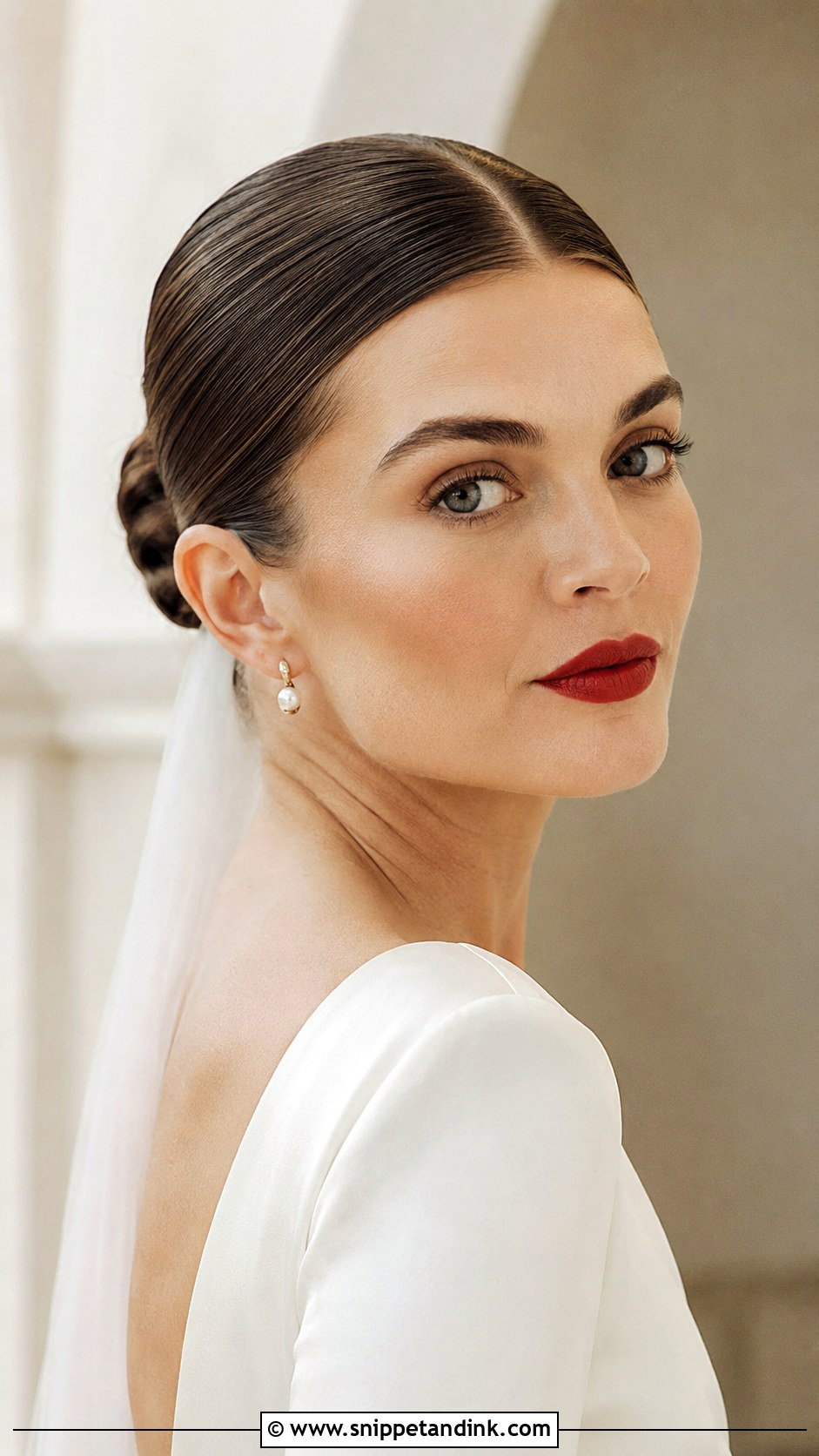 Slicked Back Bun With Middle Part - Snippet and Ink - 20 Slicked Back Bun Wedding Hair Ideas