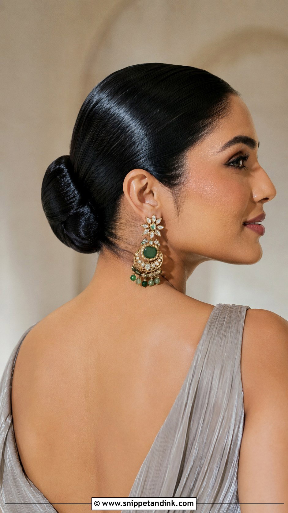 Slicked Back Bun With Statement Earrings - Snippet and Ink - 20 Wedding Guest Bun Hairstyles
