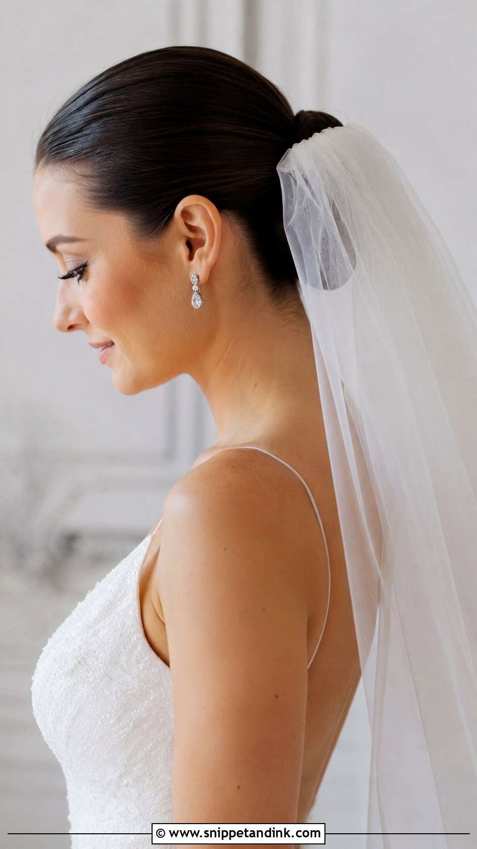 Slicked Back Bun With Veil - Snippet and Ink - 20 Slicked Back Bun Wedding Hair Ideas
