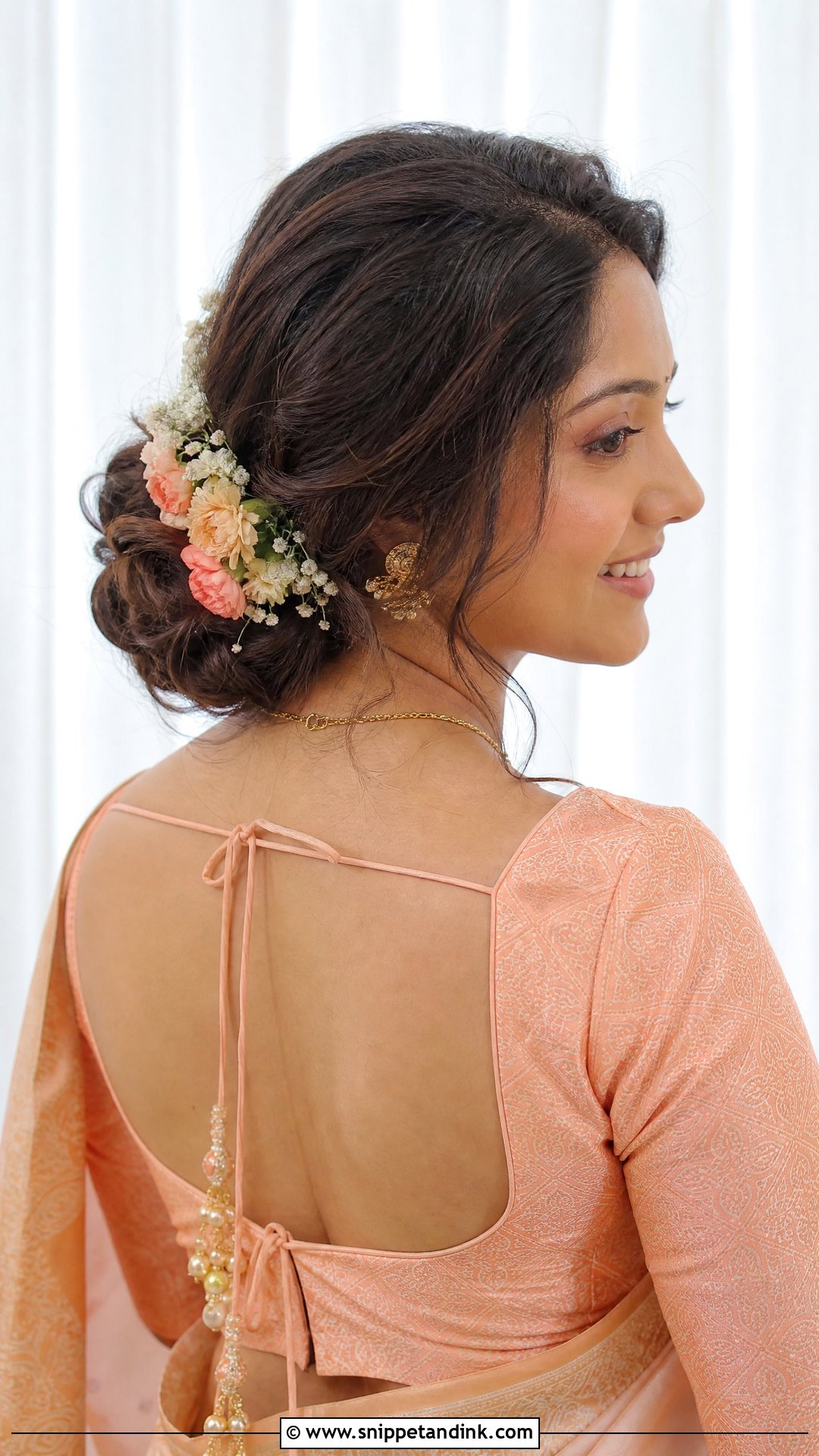 Soft Side Bun With Floral Accent - Snippet and Ink - 20 Tamil Wedding Hairstyle Ideas