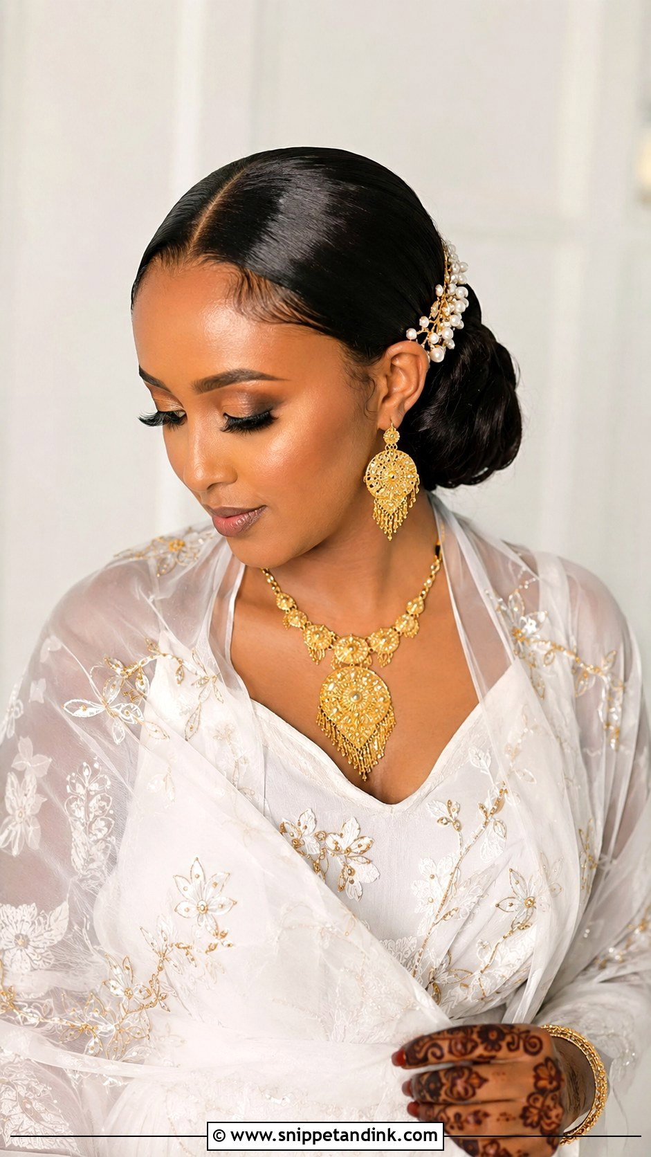 Somali Wedding Sleek Low Bun - Snippet and Ink - 15 Somali Wedding Hairstyles