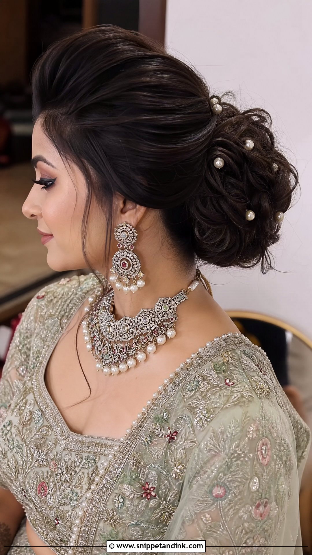 Textured Bun With Puff - Snippet and Ink - 20 Indian Hairstyle for Wedding Guest Ideas