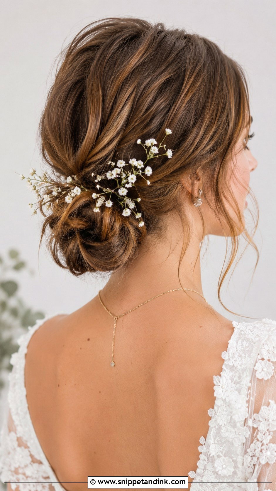 Textured Low Bun With Babys Breath - Snippet and Ink - 20 Updo Wedding Hairstyles for Short Hair