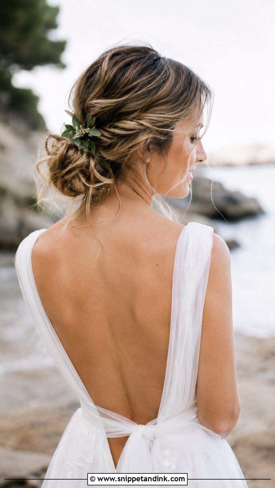 Tousled Low Bun With Loose Tendrils - Snippet and Ink - 25 Beach Bridal Hair Ideas