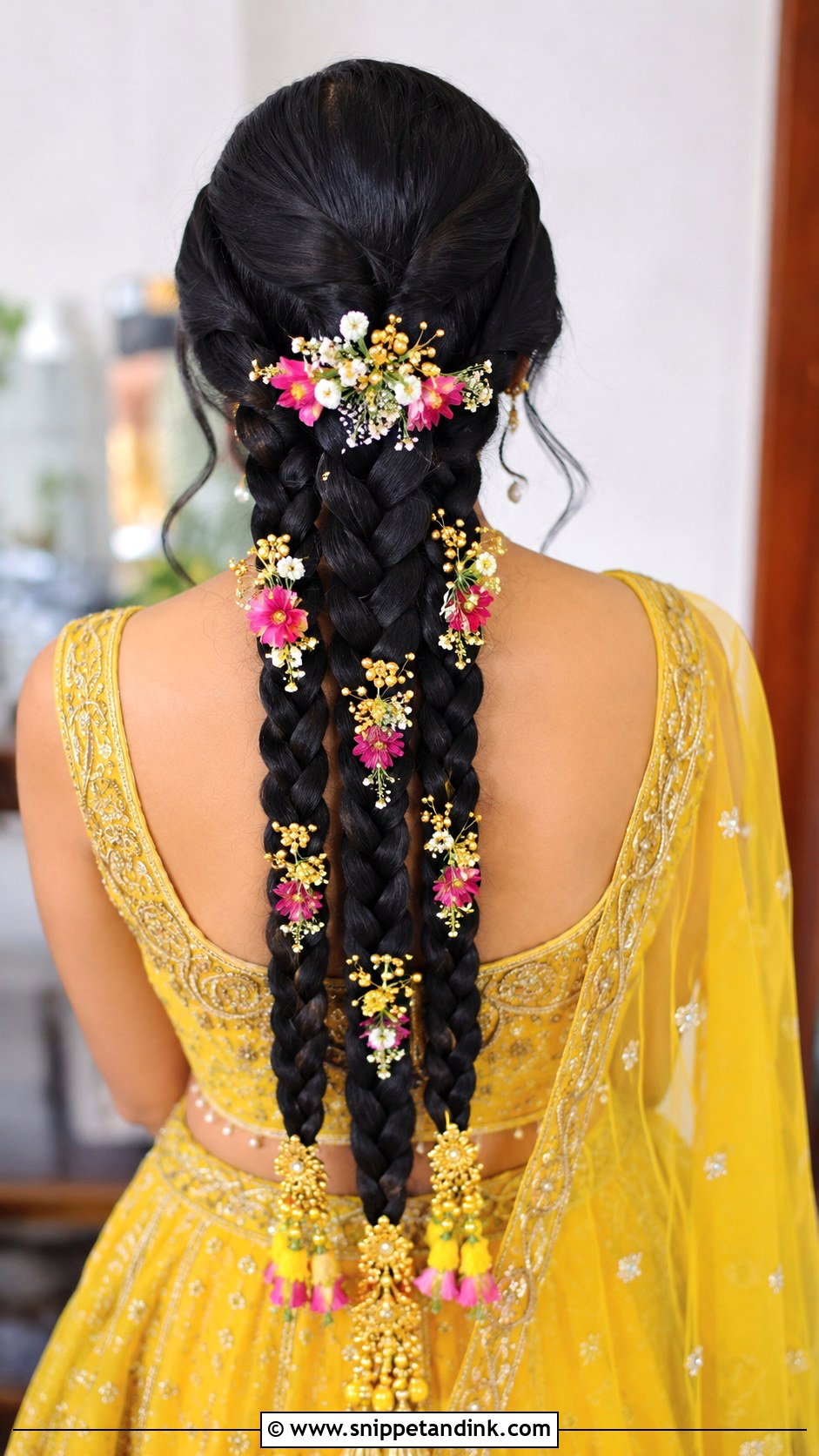 Triple Braid With Floral Accents - Snippet and Ink - 20 Haldi Braid Hairstyles for Bride