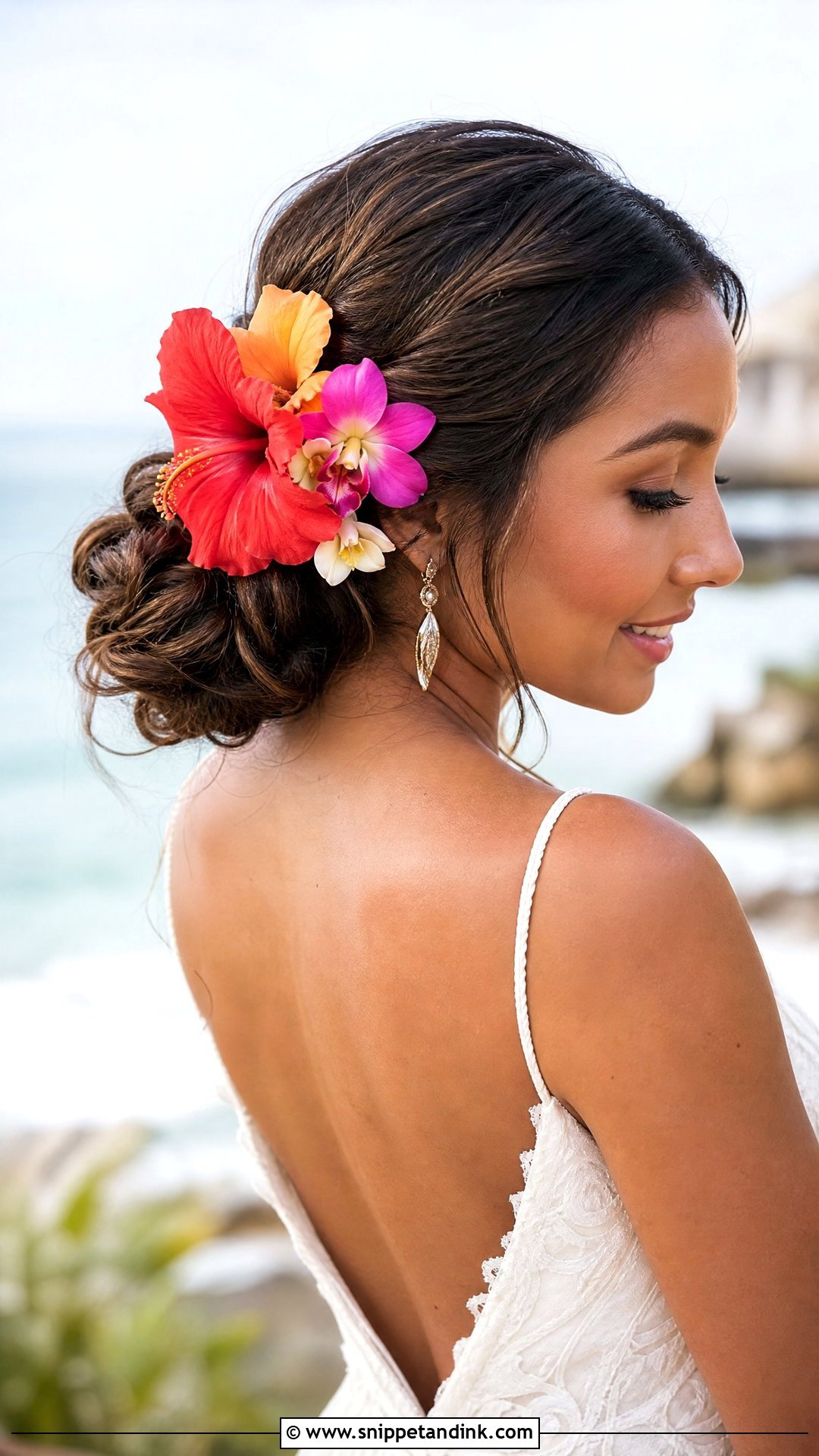 Tropical Flower Accented Updo for Beach Brides - Snippet and Ink - 20 Beach Bride Hair Ideas