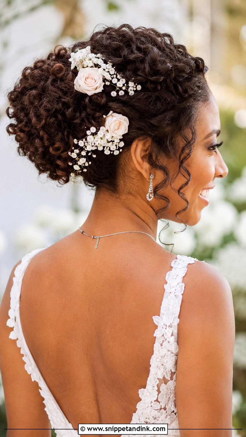 Tucked Updo With Fresh Flowers - Snippet and Ink - 25 Natural Hair Updo Wedding Ideas