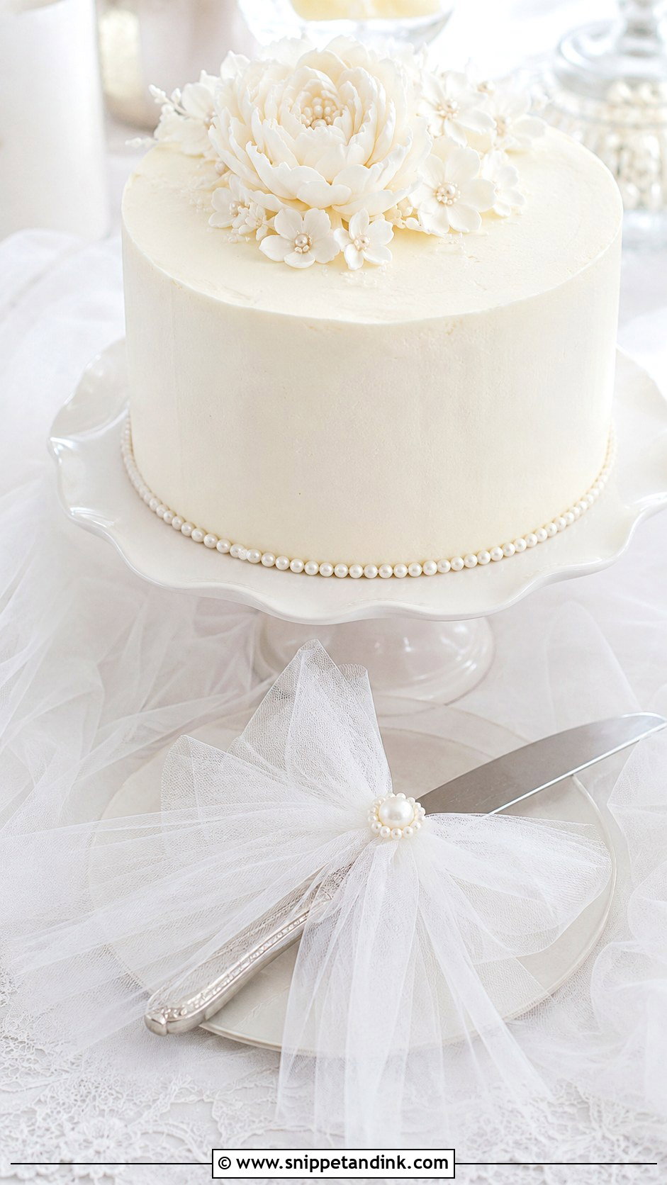 Tulle Wedding Cake Knife With Soft Wedding Cake - Snippet and Ink - 30 Wedding Cake Knife Decoration Ideas